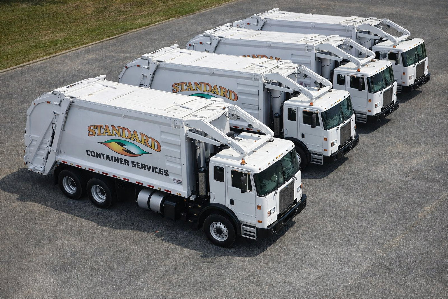 Parked waste removal trucks in a lot